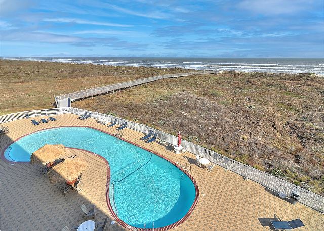 Community pool with boardwalk to the beach