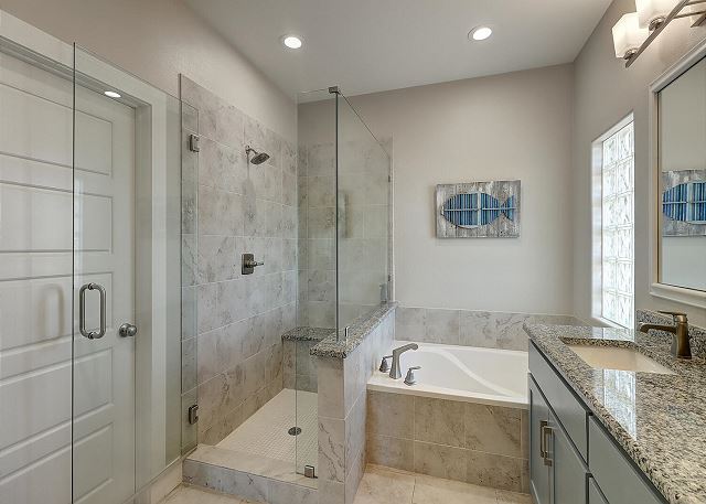 Beautiful full bathroom with walk in shower and luxurious bath