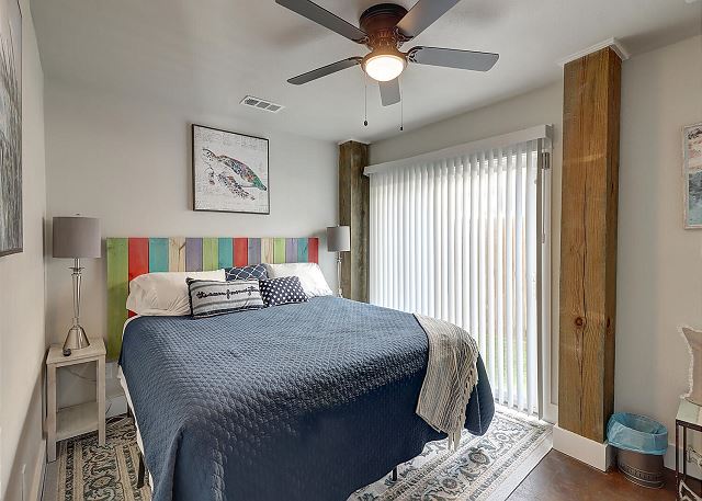Downstairs guest bedroom with sliding door to the pool