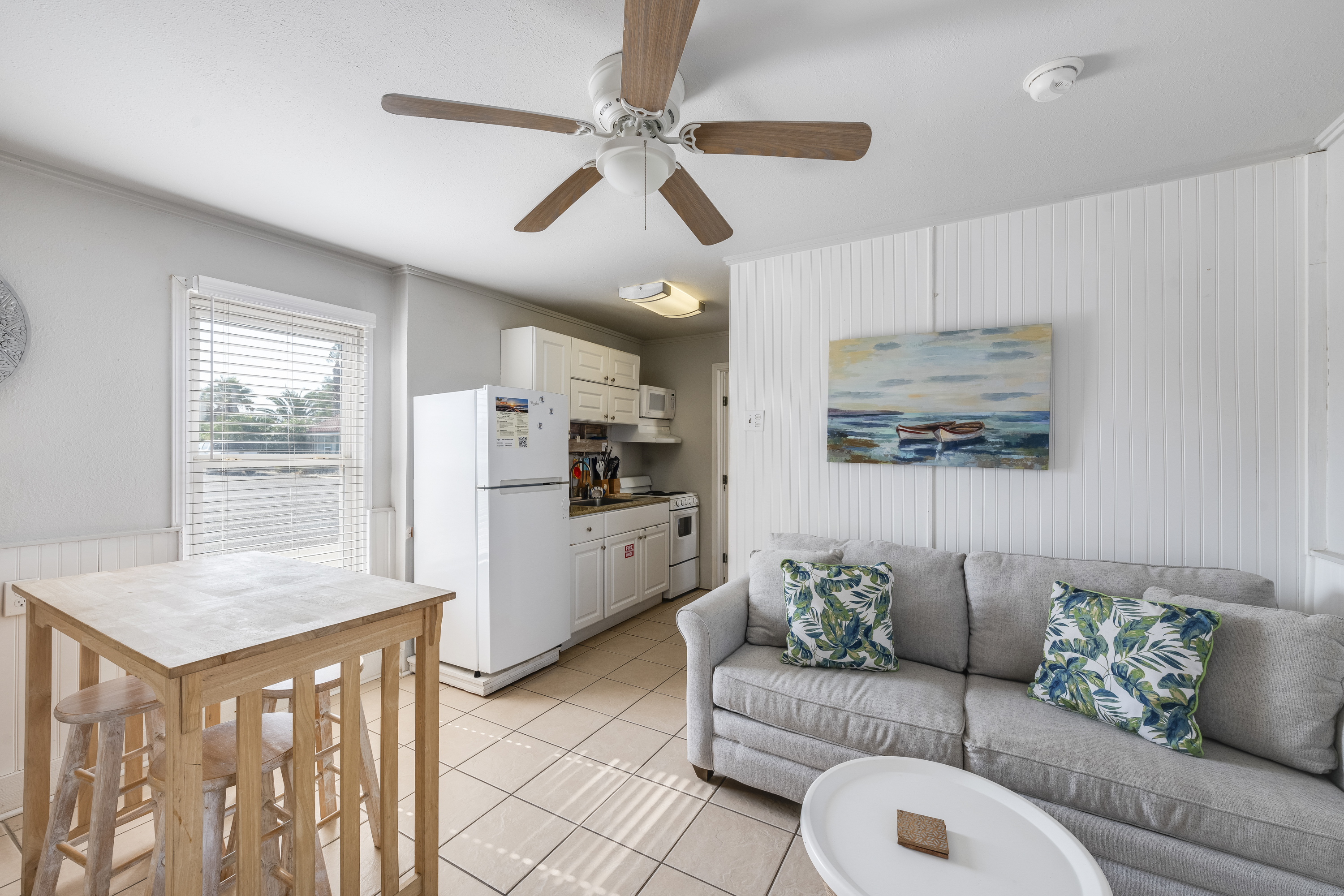 Natural light flooding the dining and living area