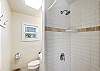 Hall bathroom with low step walk in shower