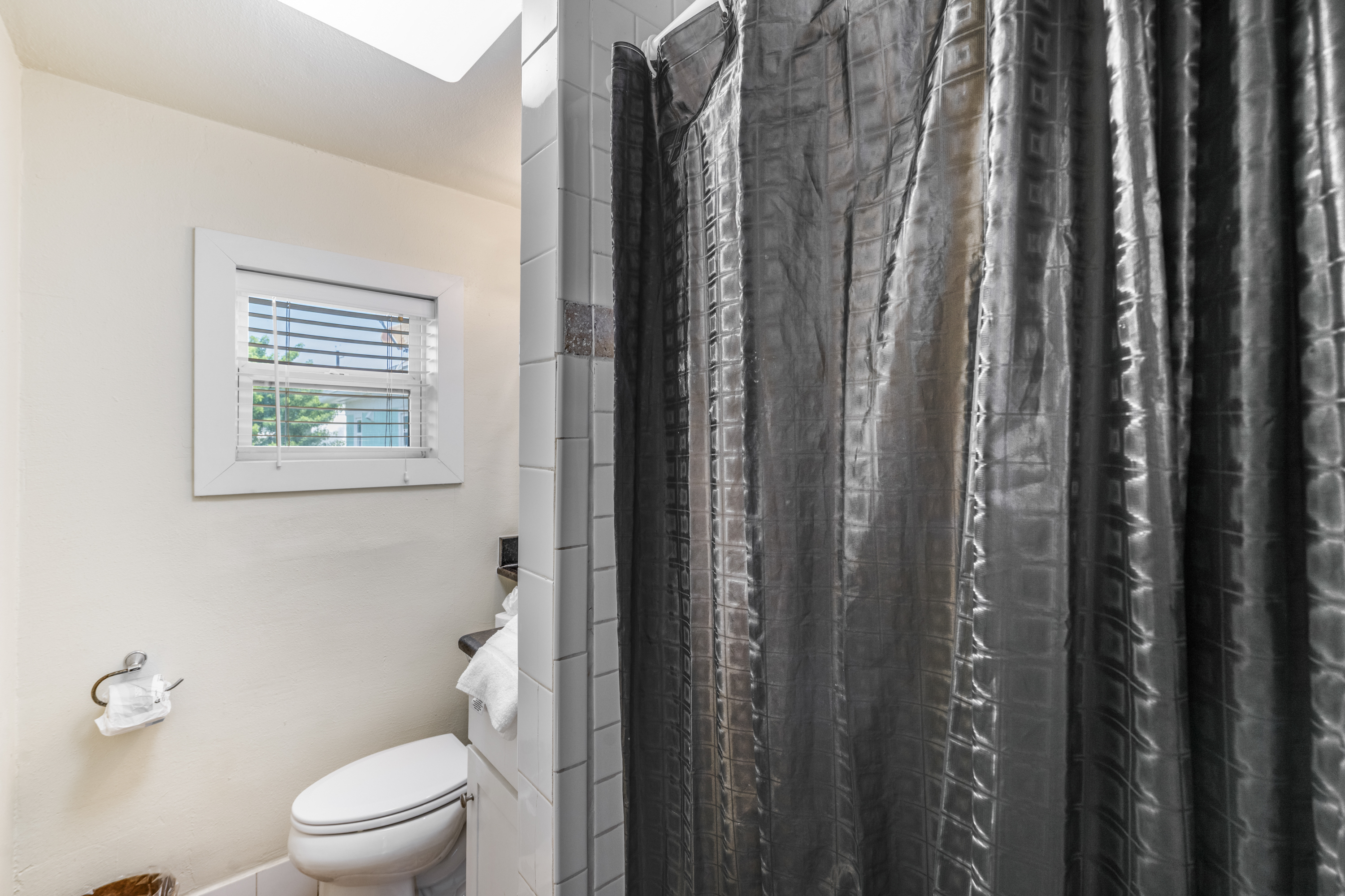 Hall bathroom-“A clean, coastal-inspired retreat for your daily unwind.”