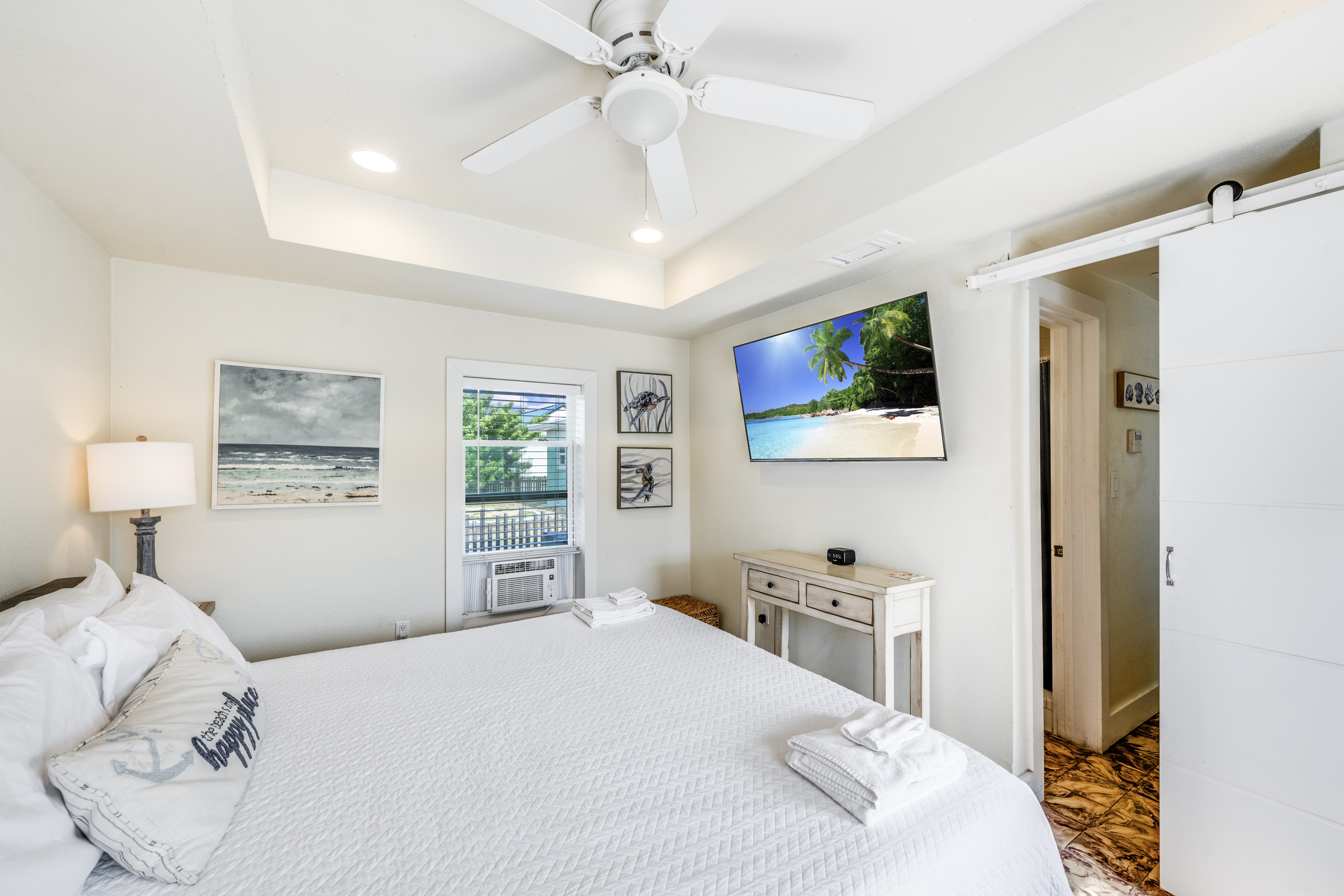 King suite with flat screen TV and coastal decor