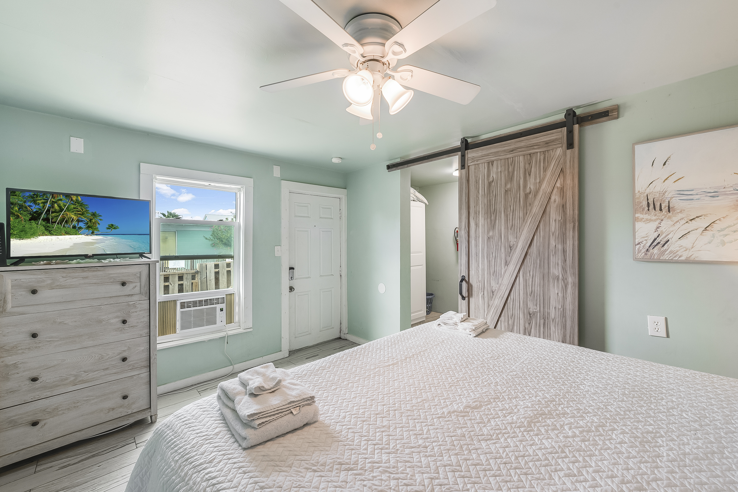 King suite with flat screen tv and access to the front yard