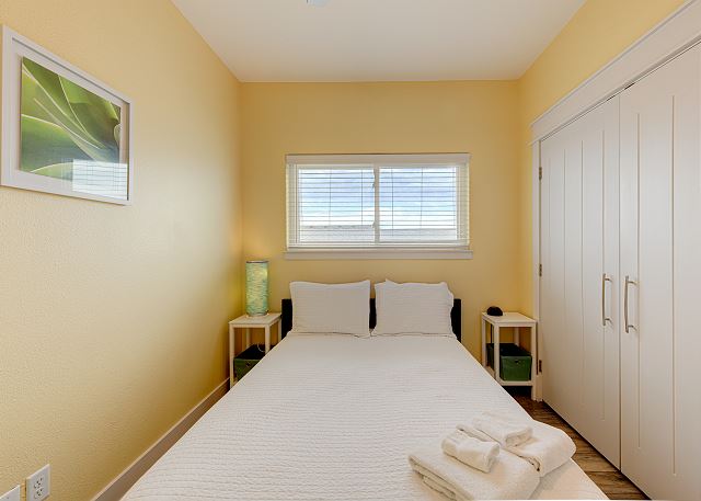 Third bedroom with Queen Bed.  Mello yellow indeed!