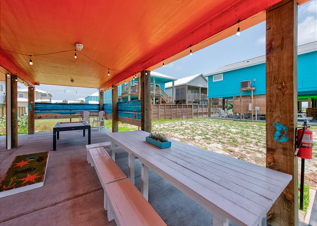 Great gathering spaces including picnic tables, cornhole, and a pool table!
