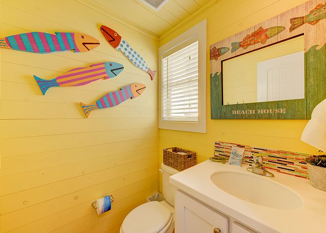 Bathroom with pops of colorful sea life motifs