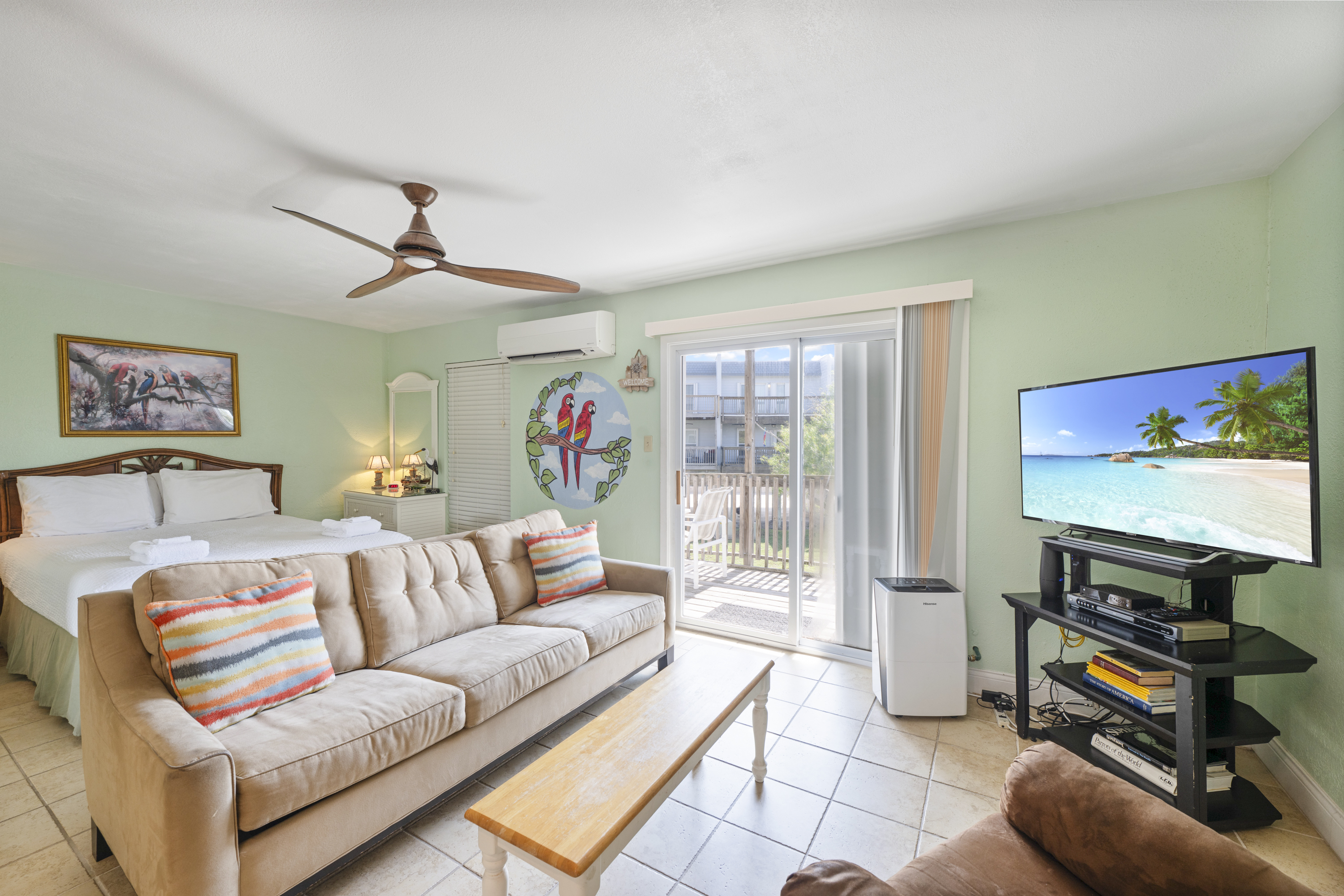This inviting coastal condo living area blends comfort with breezy seaside charm.