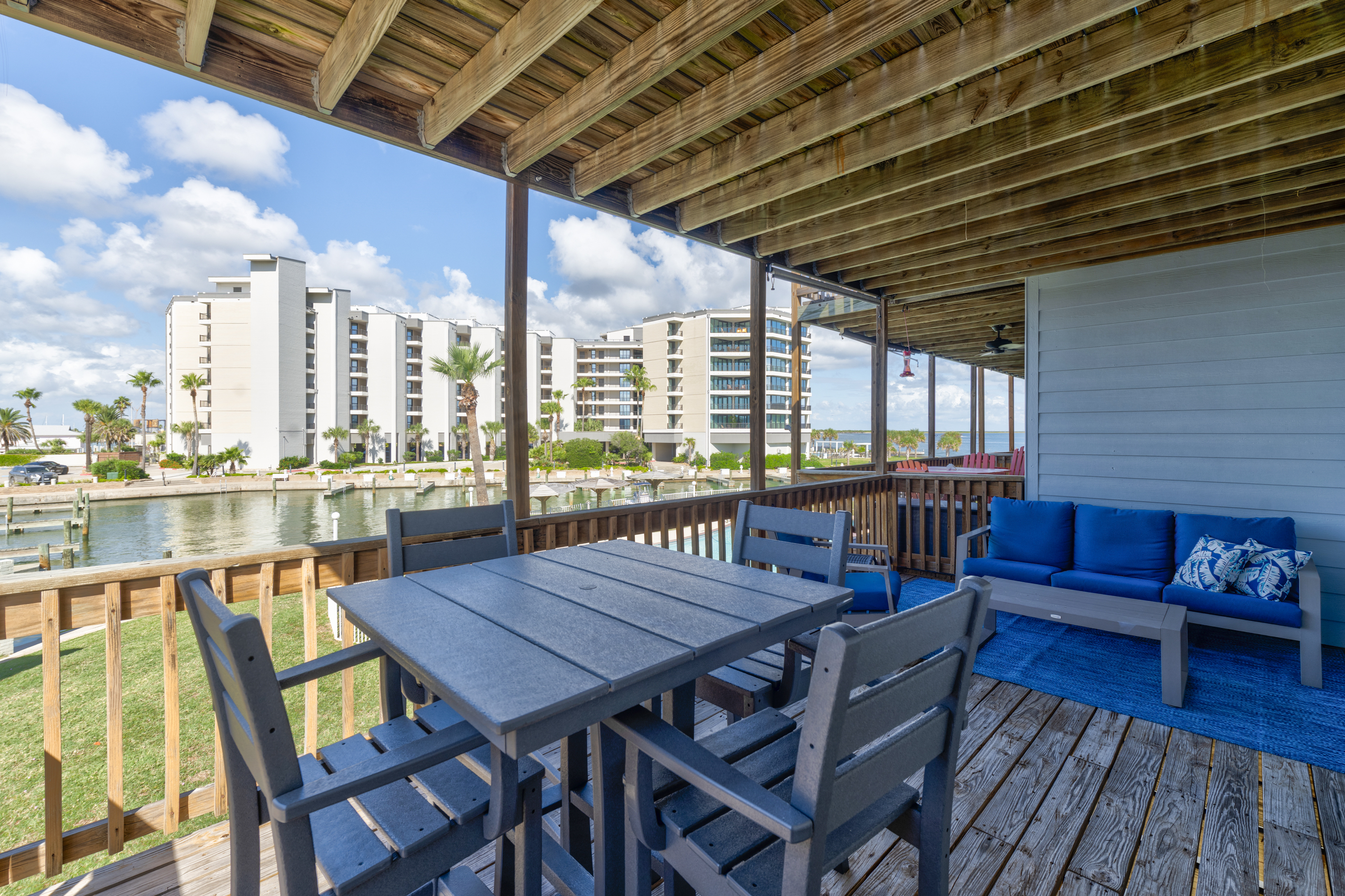 Relax, sip, or dine on the comfortably furnished shaded balcony.
