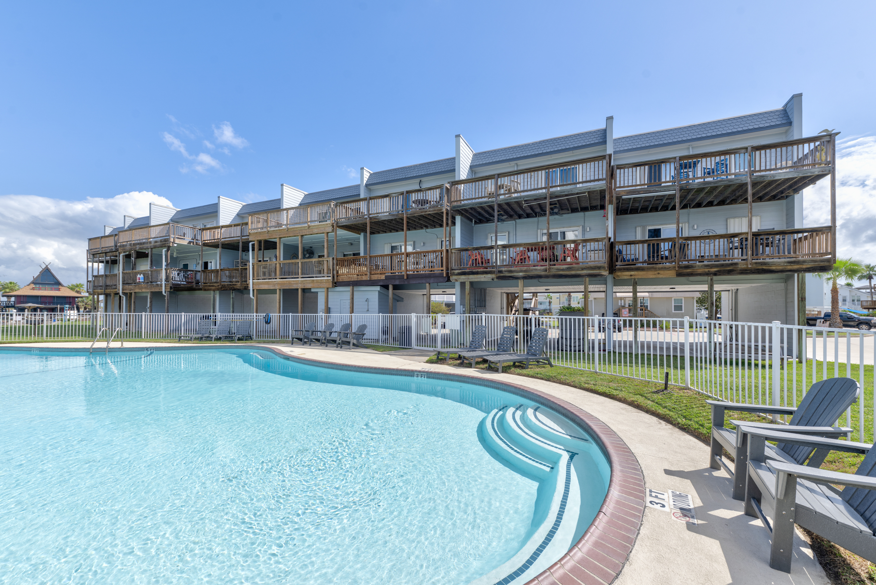 Community pool view with Bay Tree C1 positioned just above.