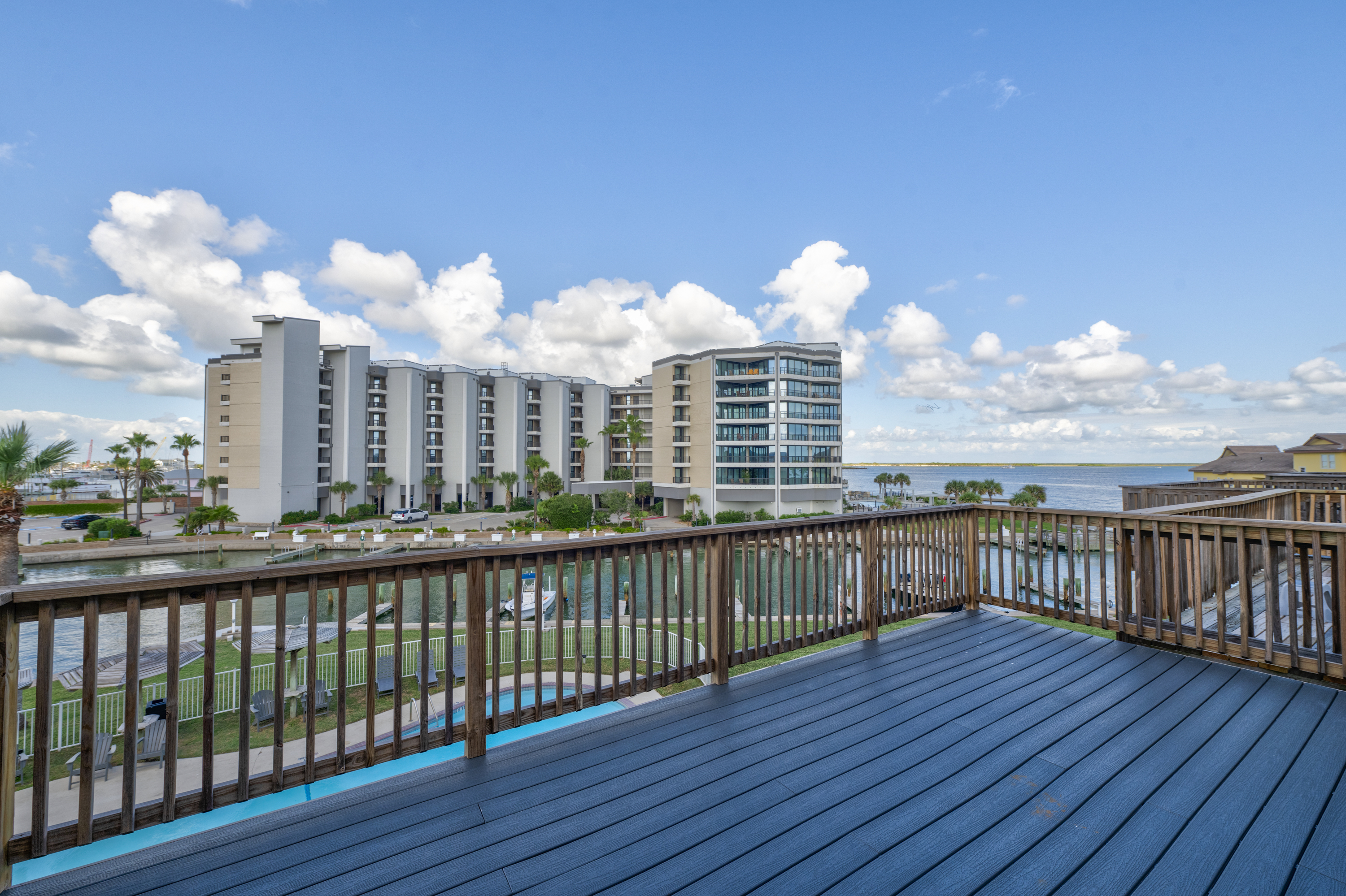 Unwind on the deck with comfy seating and loungers, taking in poolside views and the gentle passage of boats along the Channel.