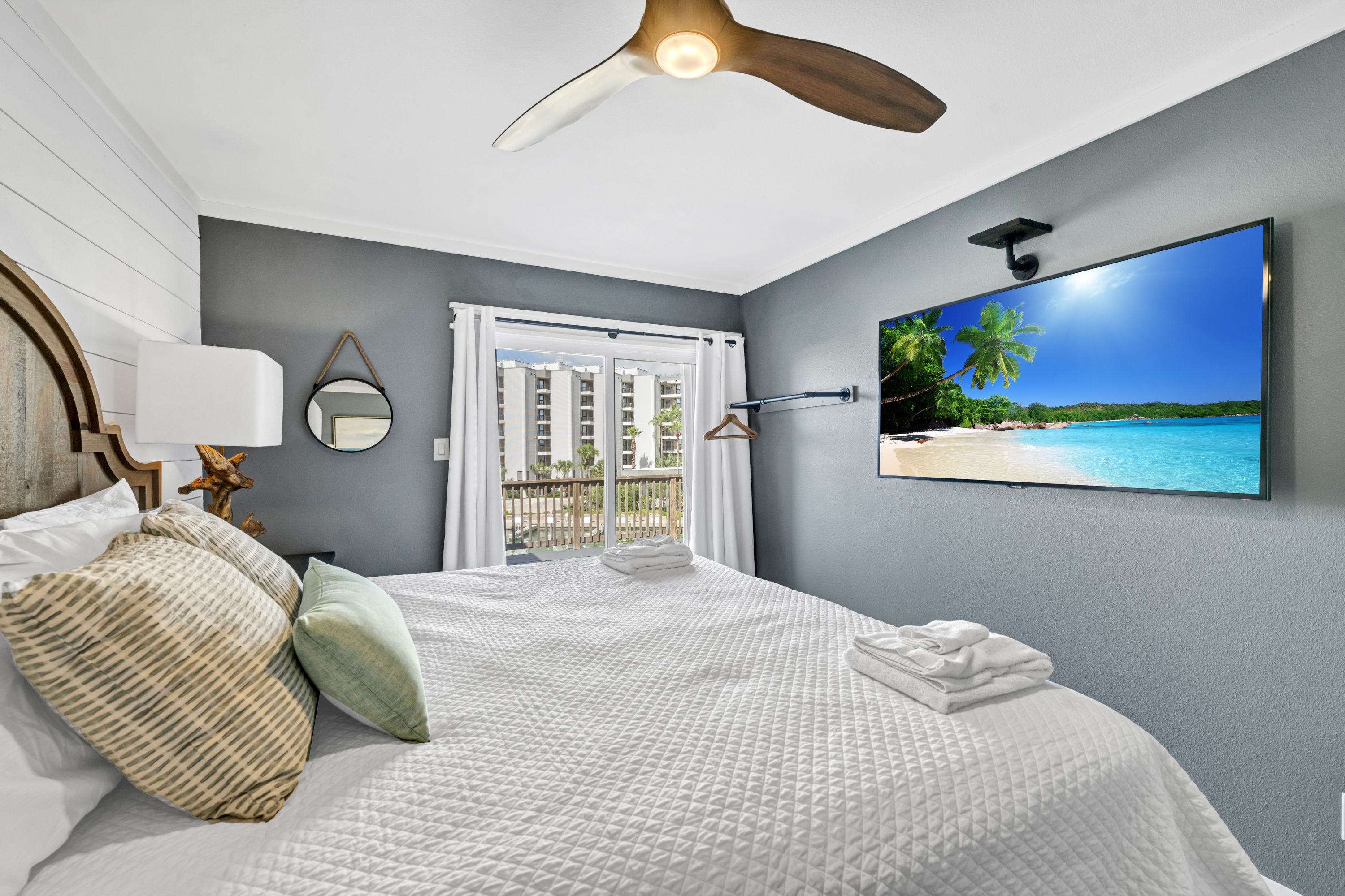 Sink into comfort in this King-size retreat, featuring a balcony deck with serene waterfront views.