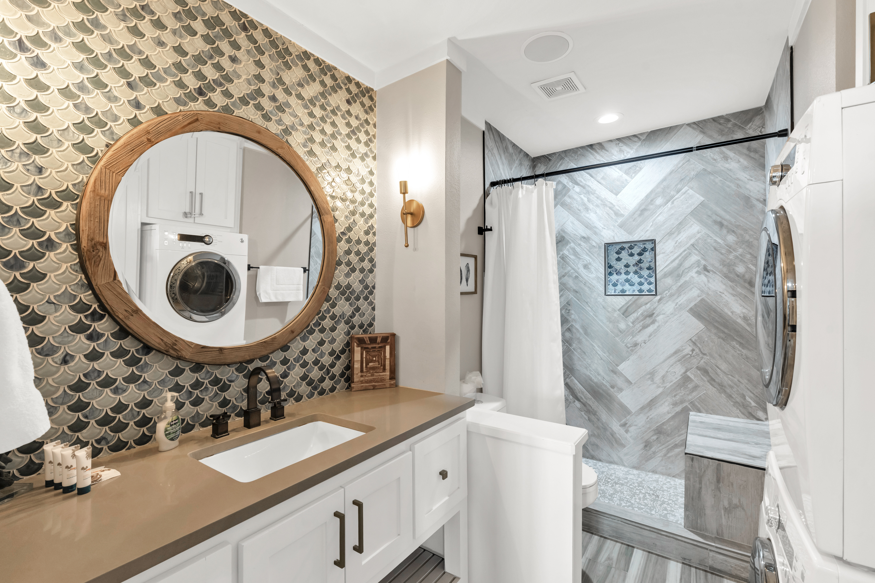 Functional and stylish: Main-level bathroom with convenient laundry access.