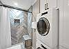 Smart design for ease: Main-level bathroom with laundry features.