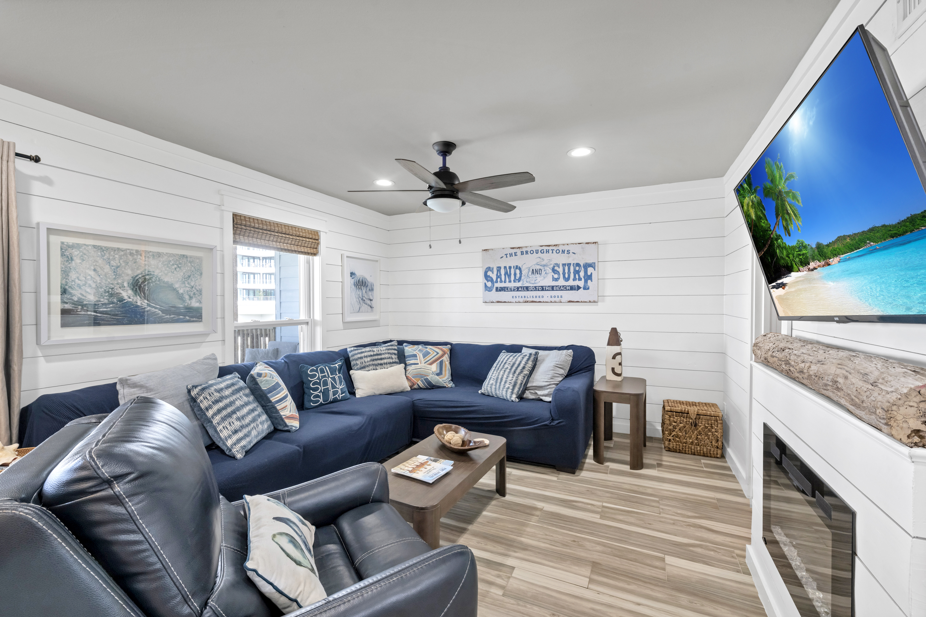 Kick back and enjoy downtime in the cozy living space. The entertainment console features a fireplace insert for cozy evenings.