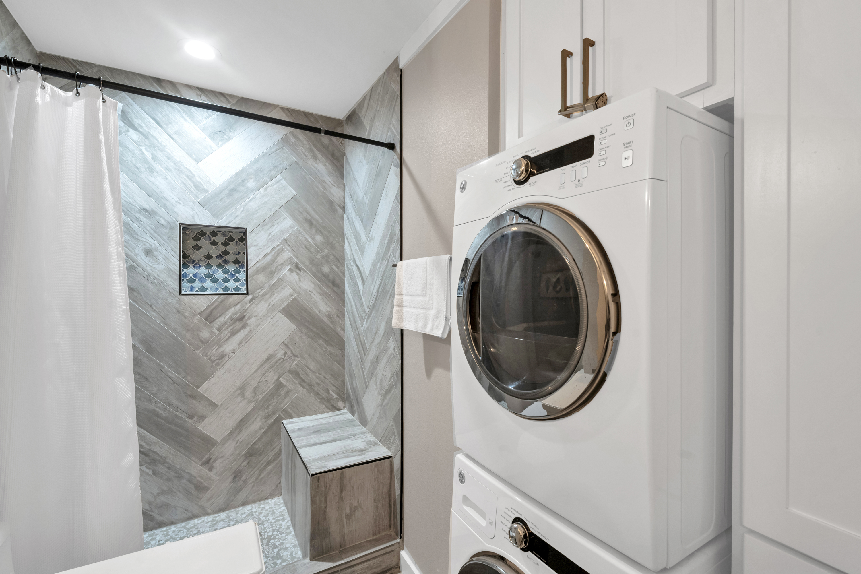 Smart design for ease: Main-level bathroom with laundry features.