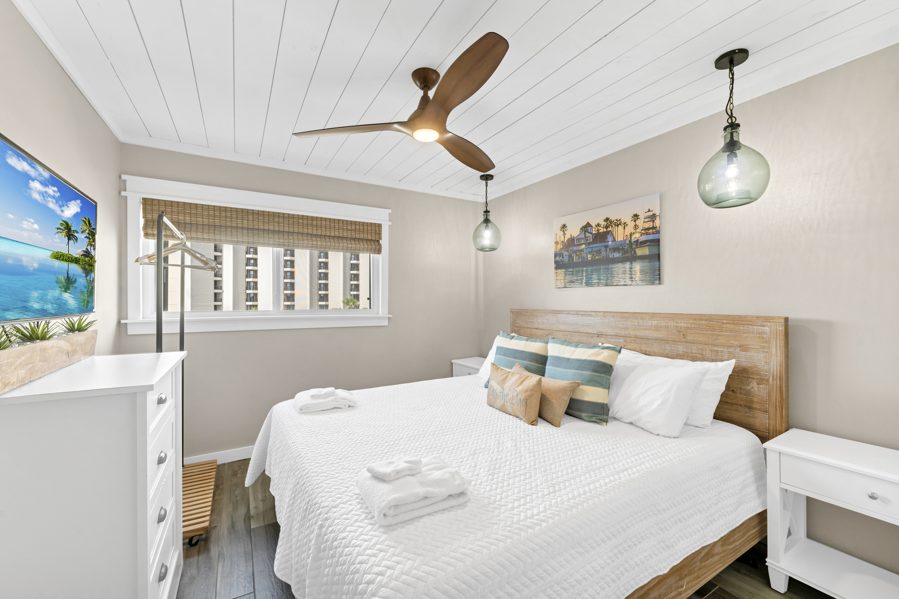 Charming 2nd King bedroom with mounted TV for laid-back coastal comfort