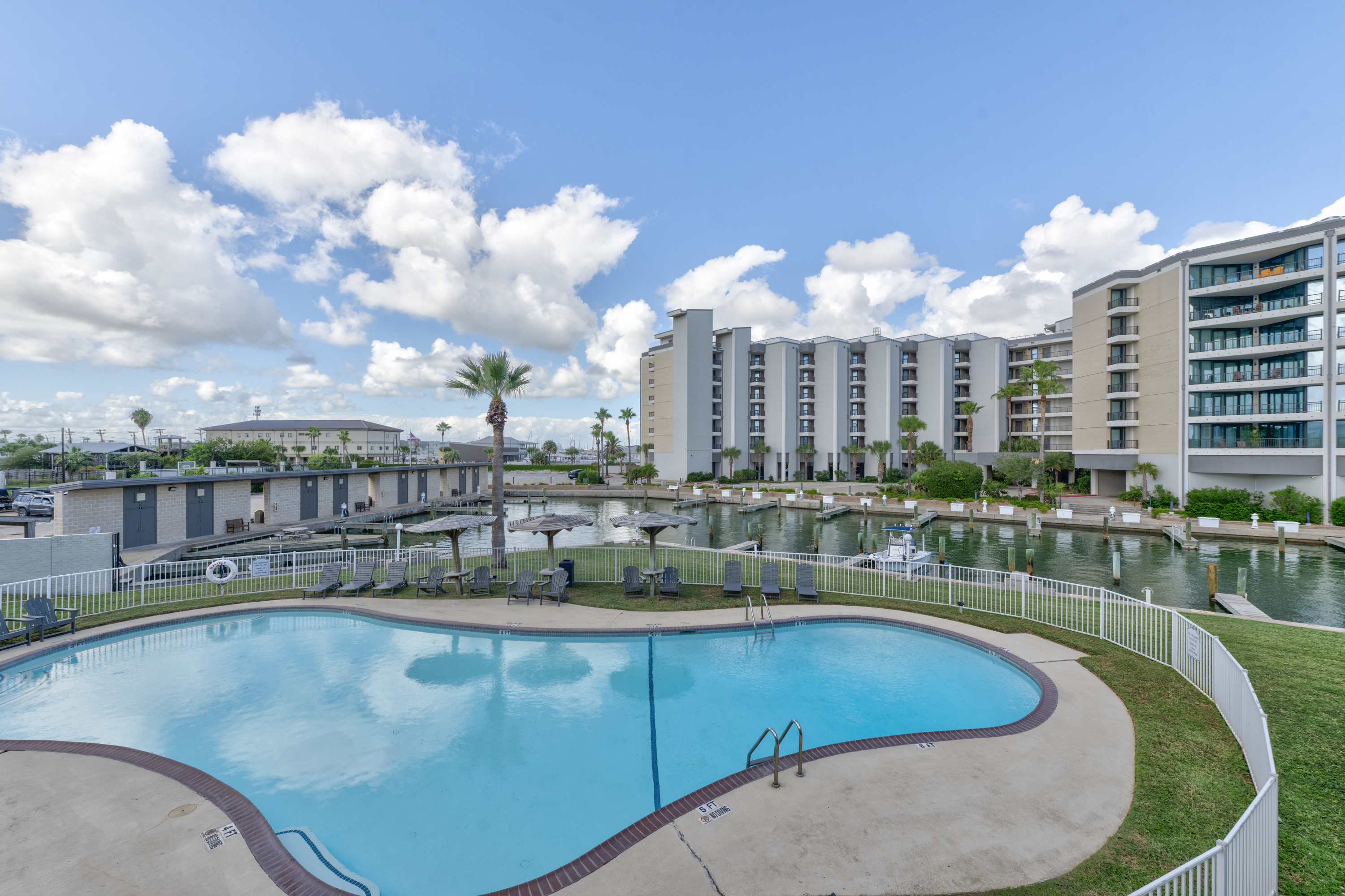 Breathtaking view of pool and boat slips. 