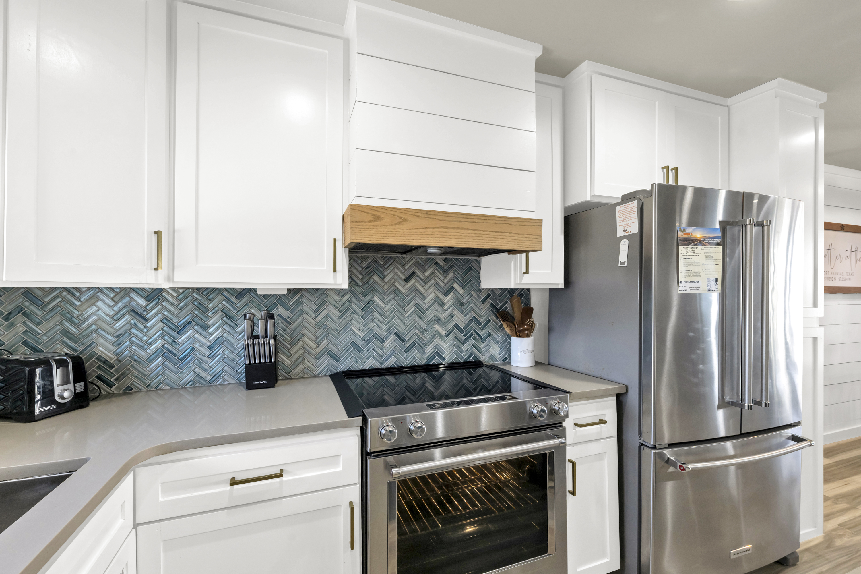 All stainless steel appliances in a sleek and modern kitchen.