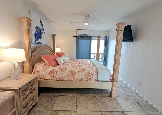 Primary bedroom - King size bed with large flat screen TV and private balcony.
