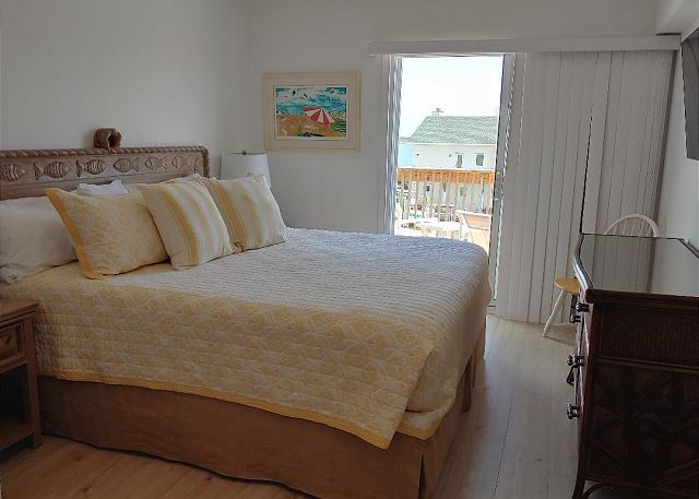 
Primary bedroom - King size bed with large flat screen TV and private balcony.
