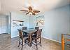 Dining area looking into kitchen and entry way