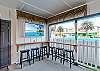 Outdoor TV and bar area in the carport