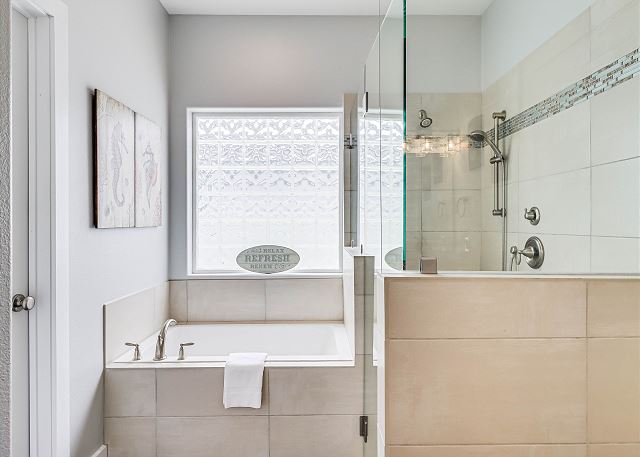 Primary bathroom with separate tub and shower