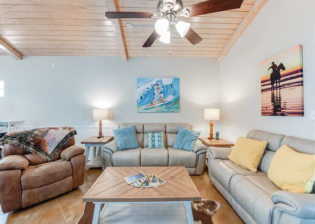 Spacious and cozy living with Coastal Cowboy Art! 