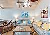 Spacious and cozy living with Coastal Cowboy Art! 