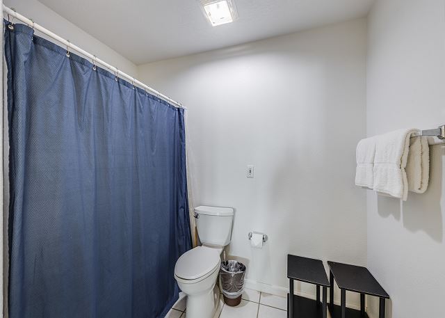 Stylish bathroom boasting a sleek toilet and contemporary sink with ample counter space 