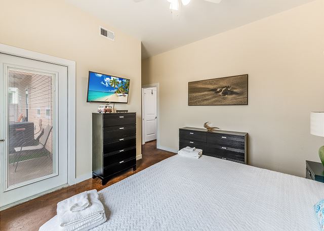 Primary bedroom with patio access