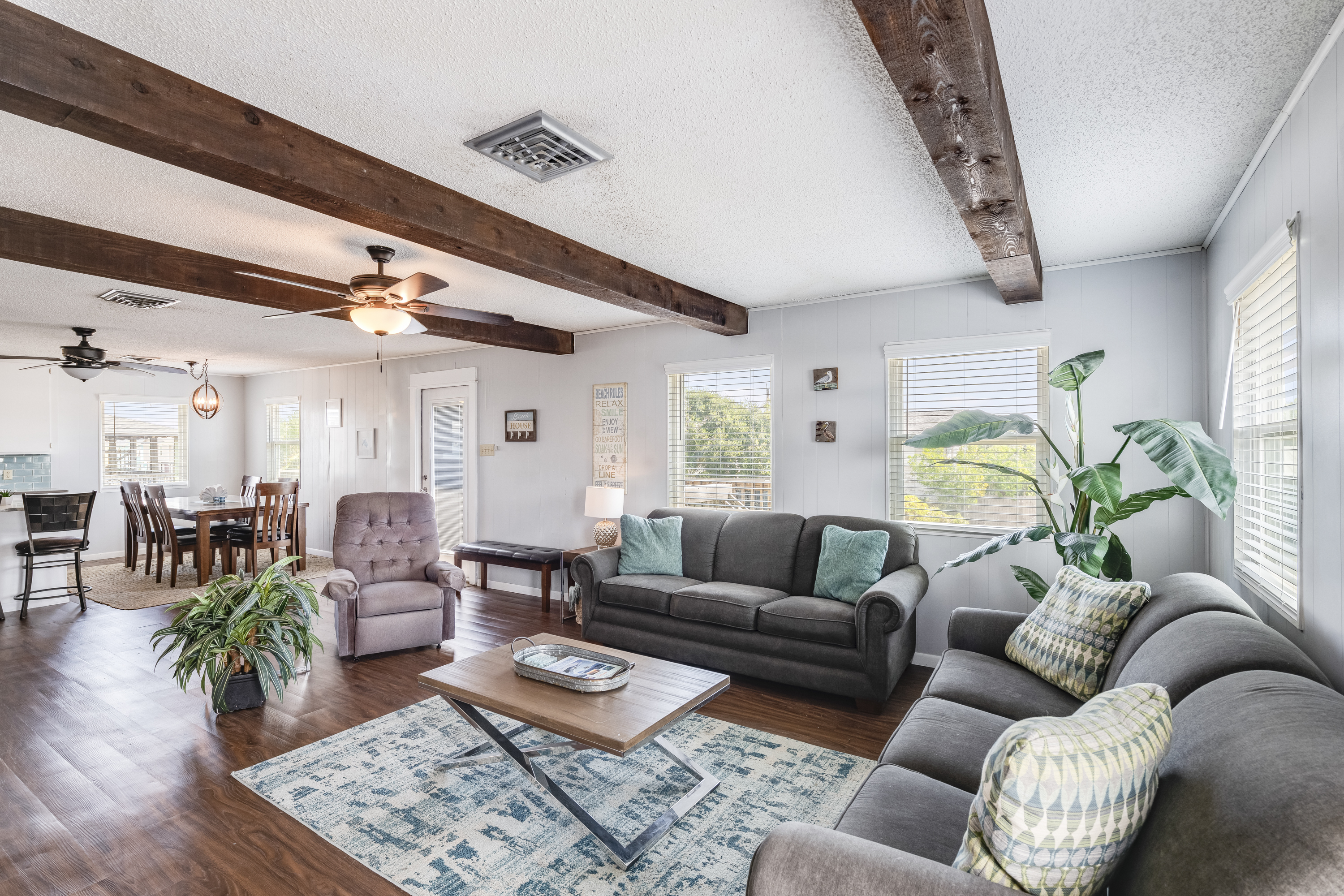 The open layout keeps you connected to the dining and kitchen areas, making it the perfect space for gathering, lounging, and enjoying your Port Aransas getaway