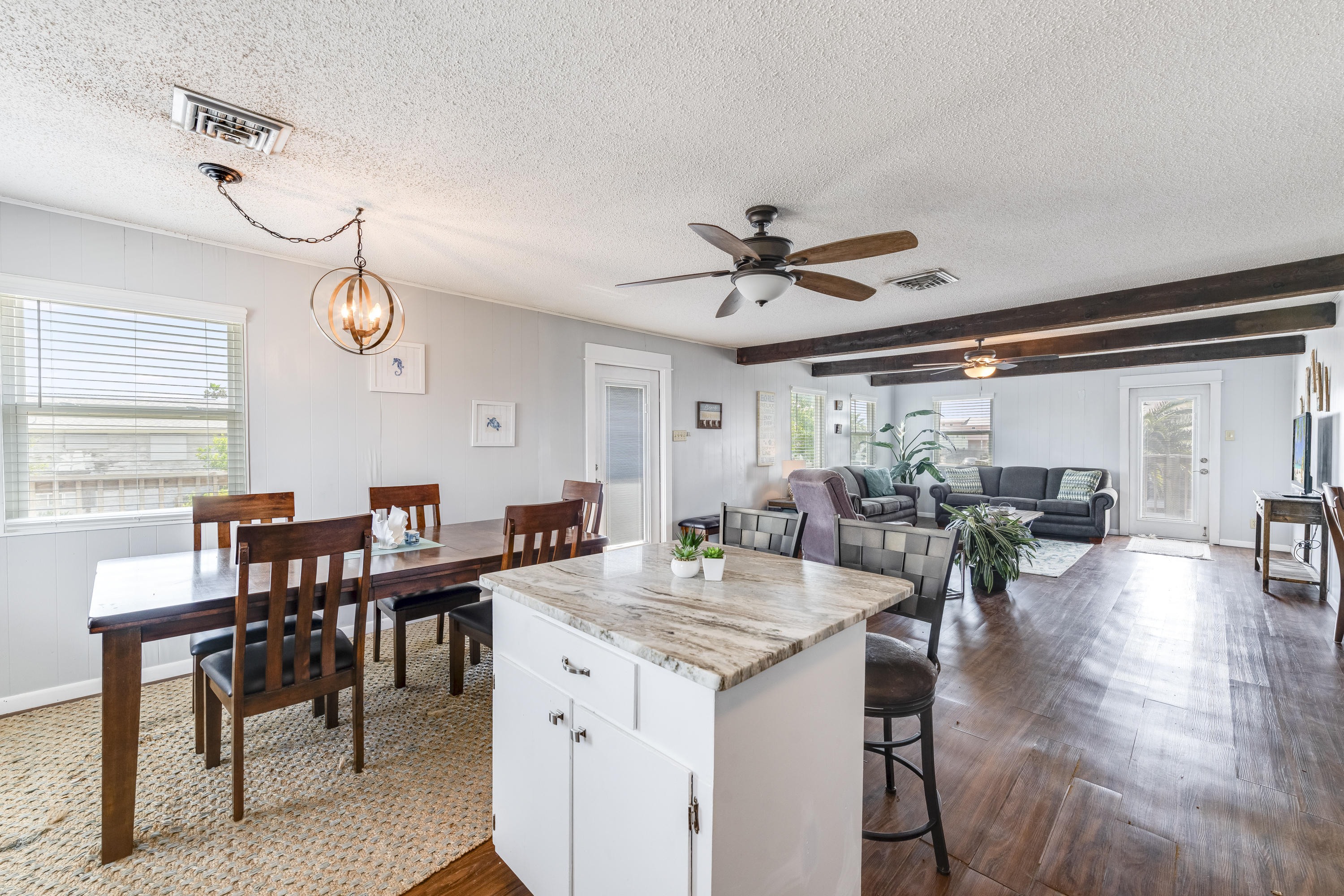 This open-concept space blends cooking, dining, and lounging into one beautifully connected area