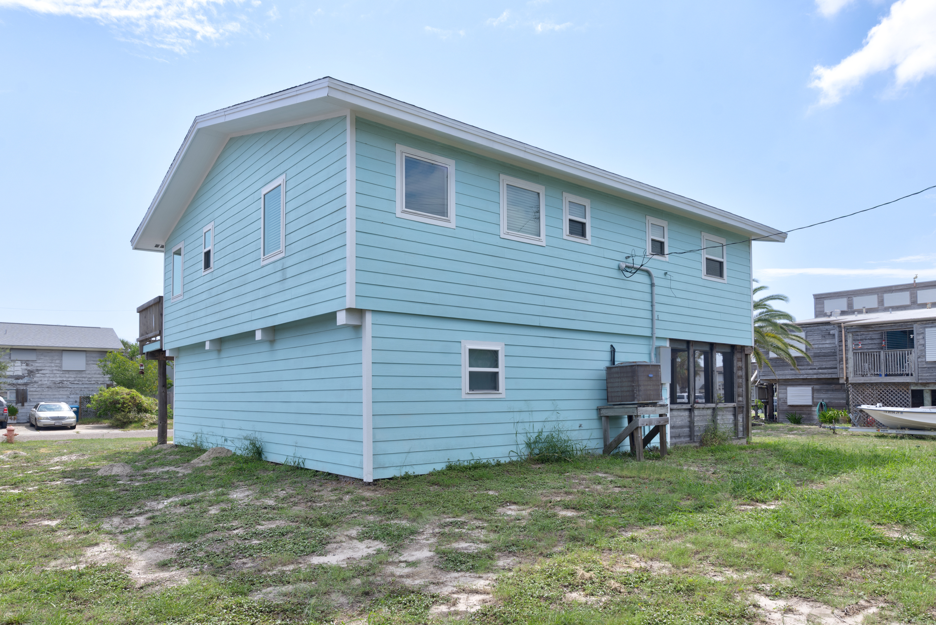 Your bright coastal escape awaits with a large yard offering plenty of space for outdoor fun or for boat parking