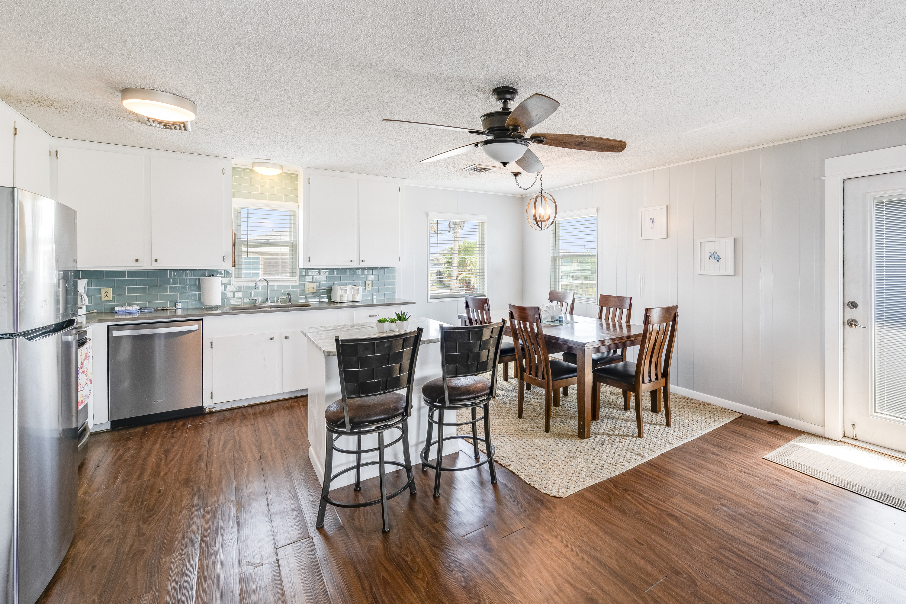 The spacious dining table sits 5 and is just steps from the kitchen island with seating for 2 more making it easy to share meals together