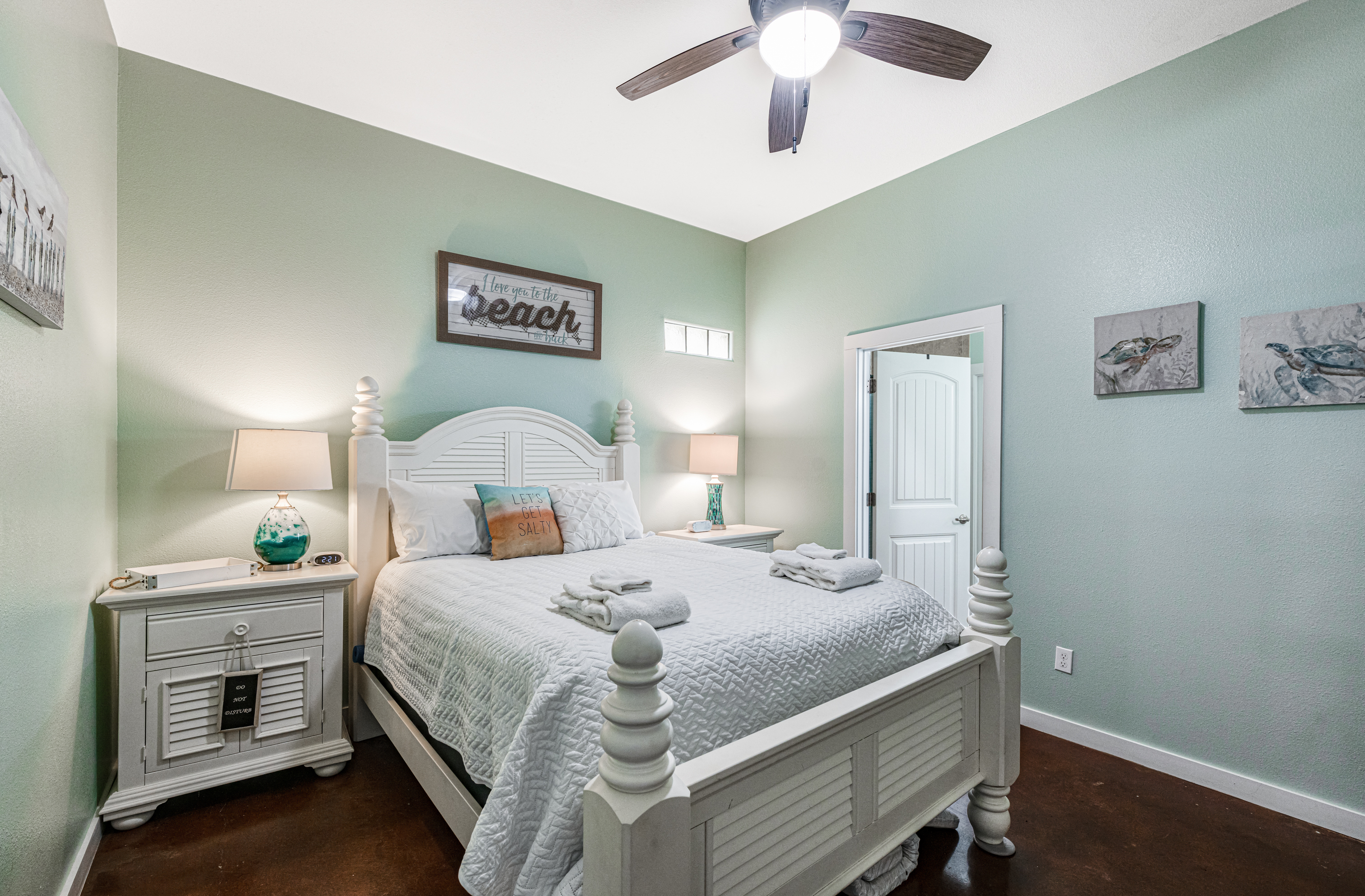 Beach Decor Features in this Primary Queen Bedroom with Private Attached Full Bath