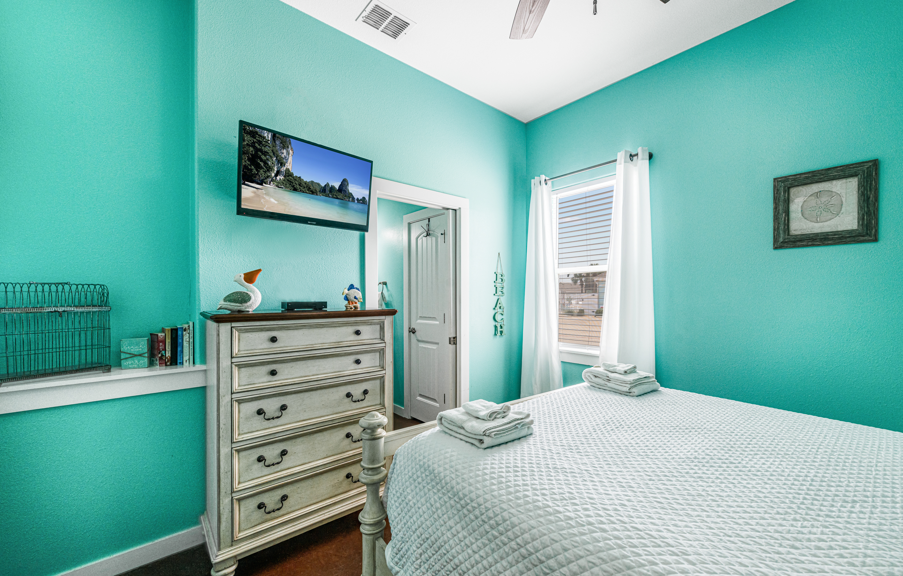 2nd Queen Bedroom with Mounted TV for Entertainment and Dresser for Storage