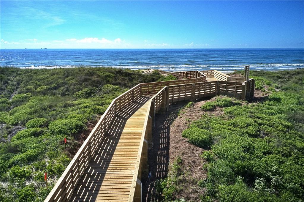 Enjoy a Morning Stroll Down the Boardwalk as the Sun Rises Over the Waves 