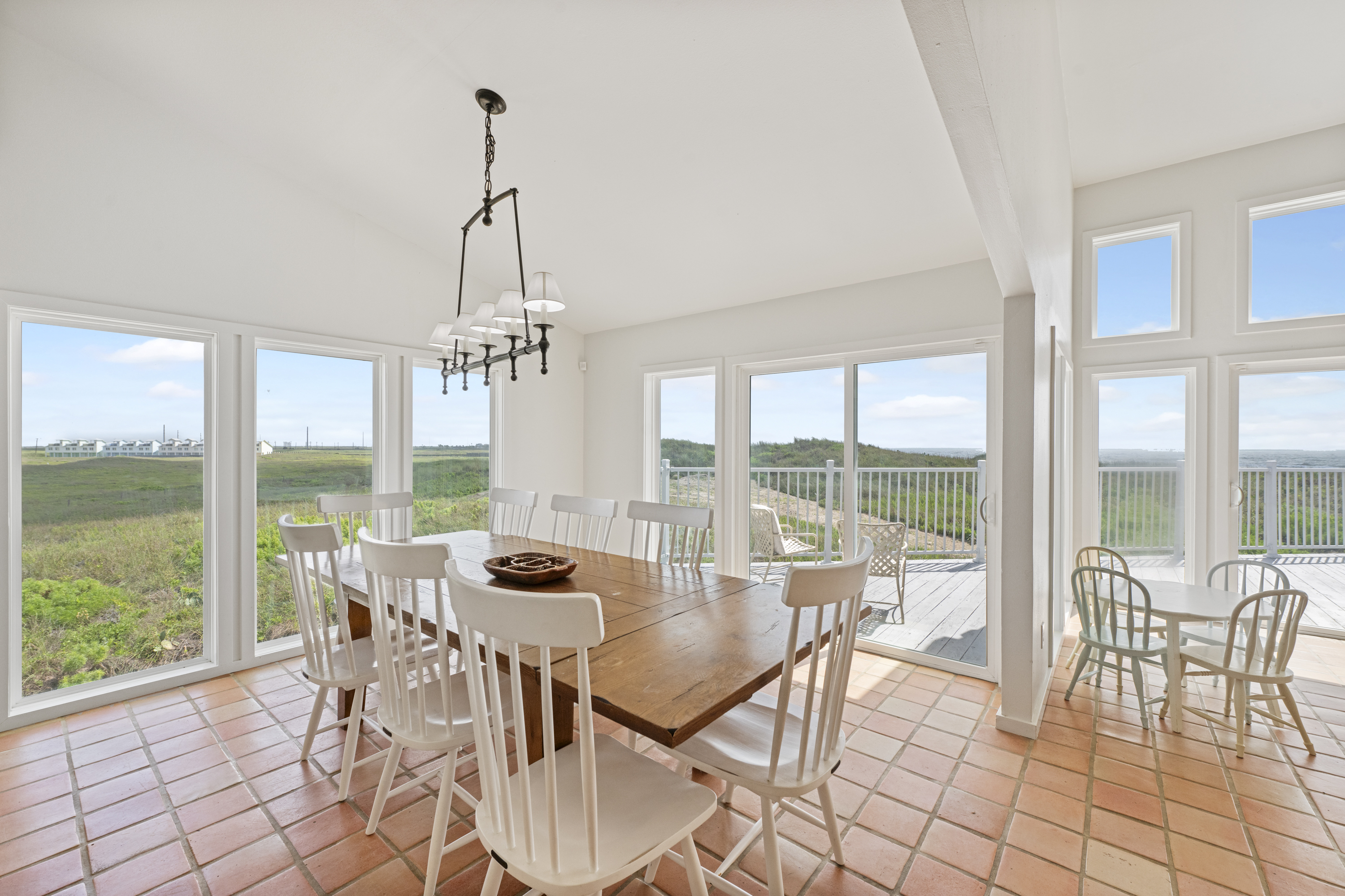 Dining Area with a Gulf-Side Glow: Table for 8 with Bonus Table for 4