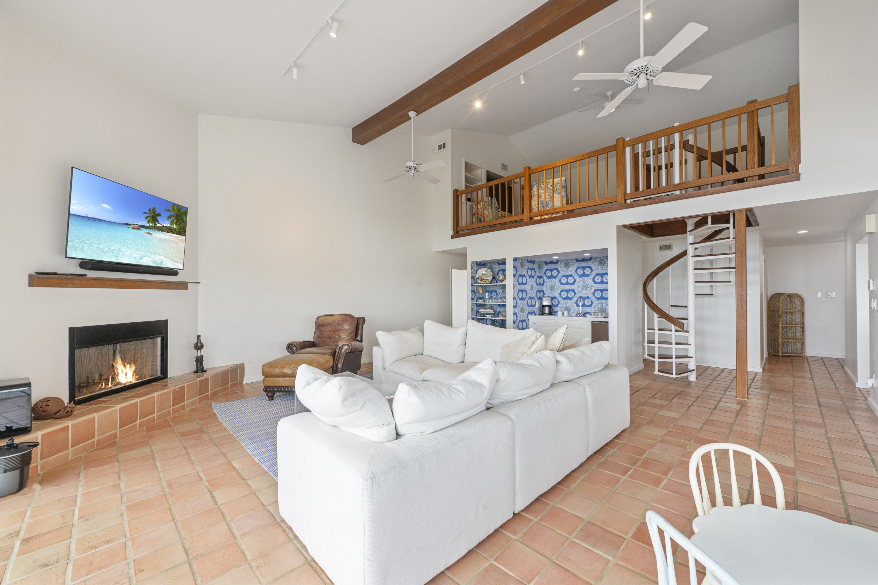Spiral Staircase Leading up to Charming Loft 