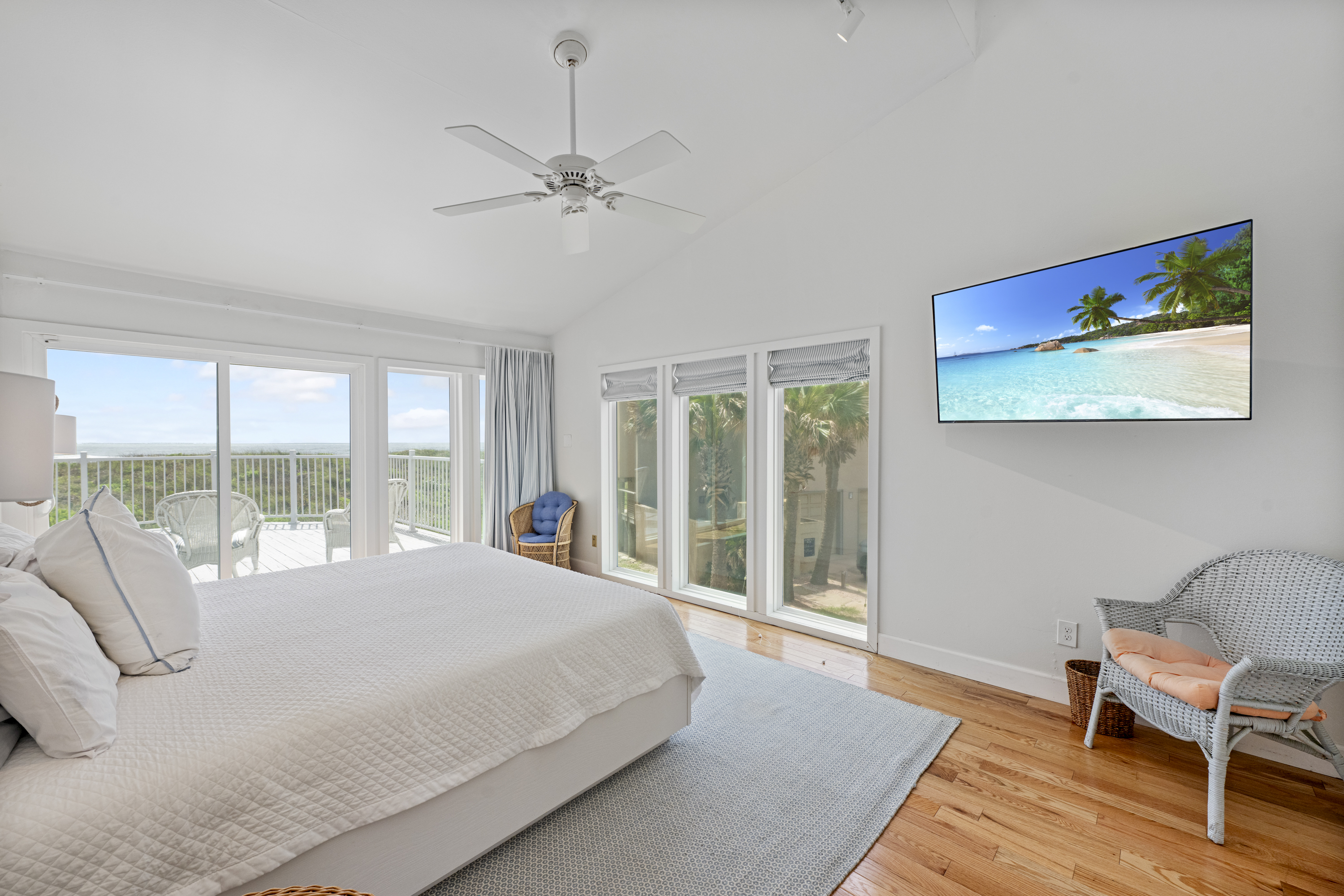 Primary King Bedroom Suite with Attached Full Bathroom, Gulf Views and Mounted TV for Entertainment 