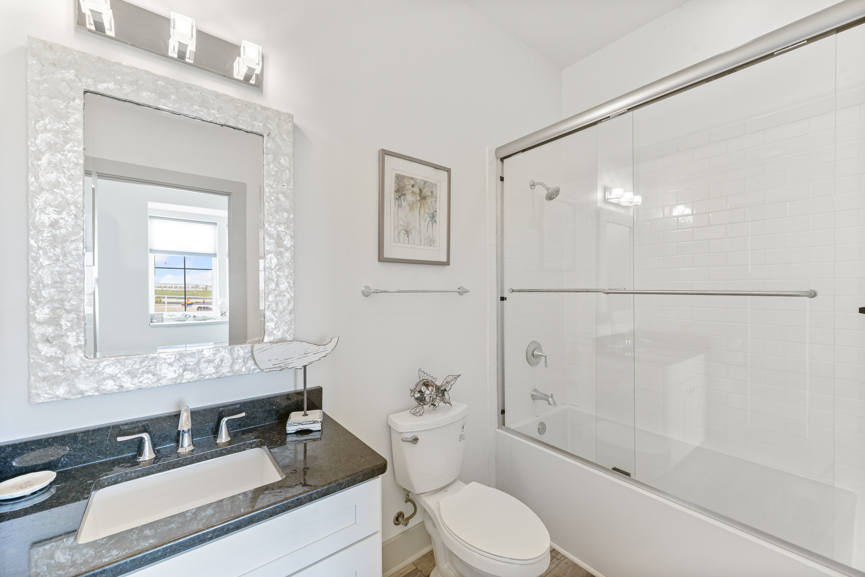 One of Three Full Bathrooms with Coastal Themes Featured at Piper Condo IMB5