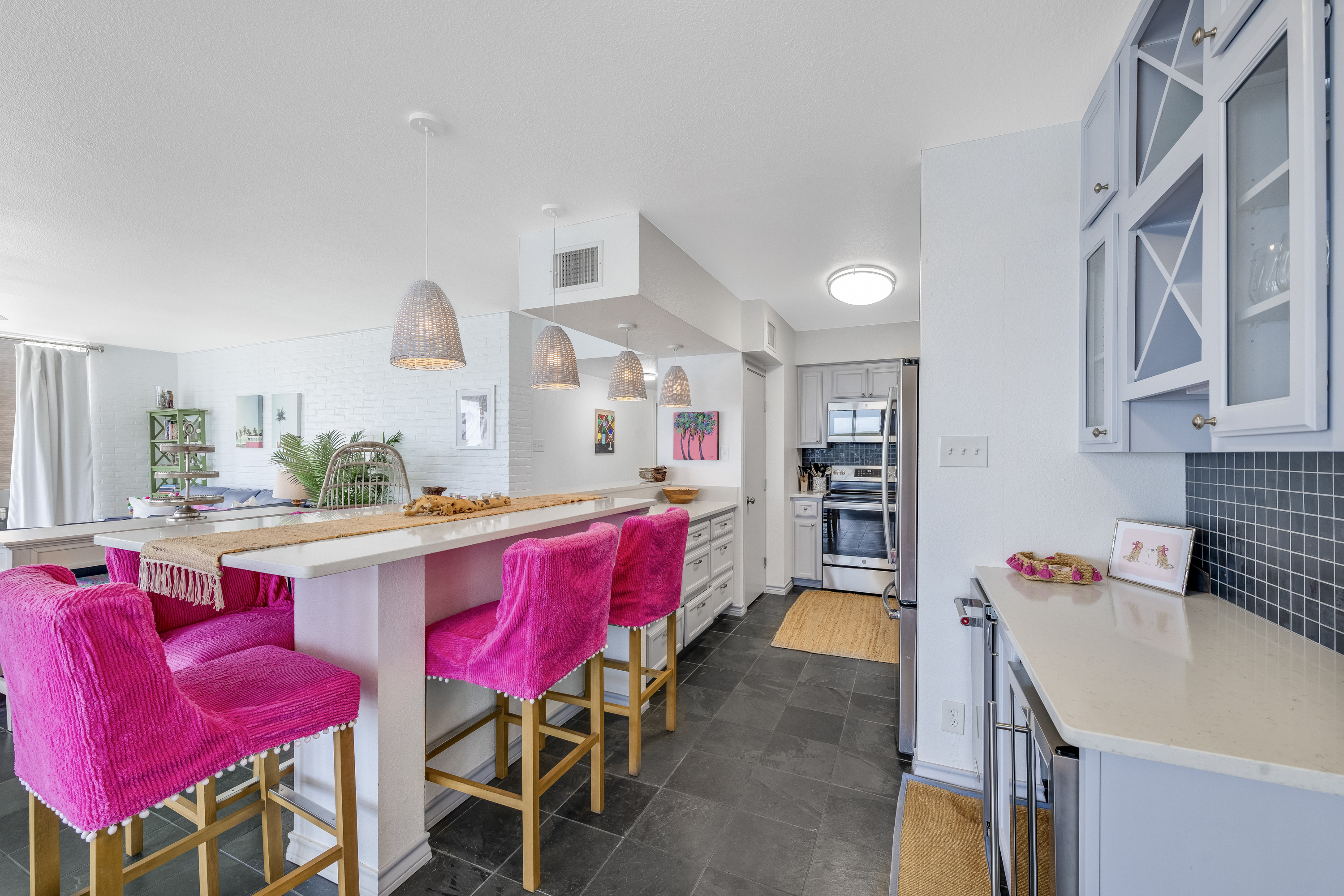 Colorful Bar Stools Add a Playful Touch to the Dining Area