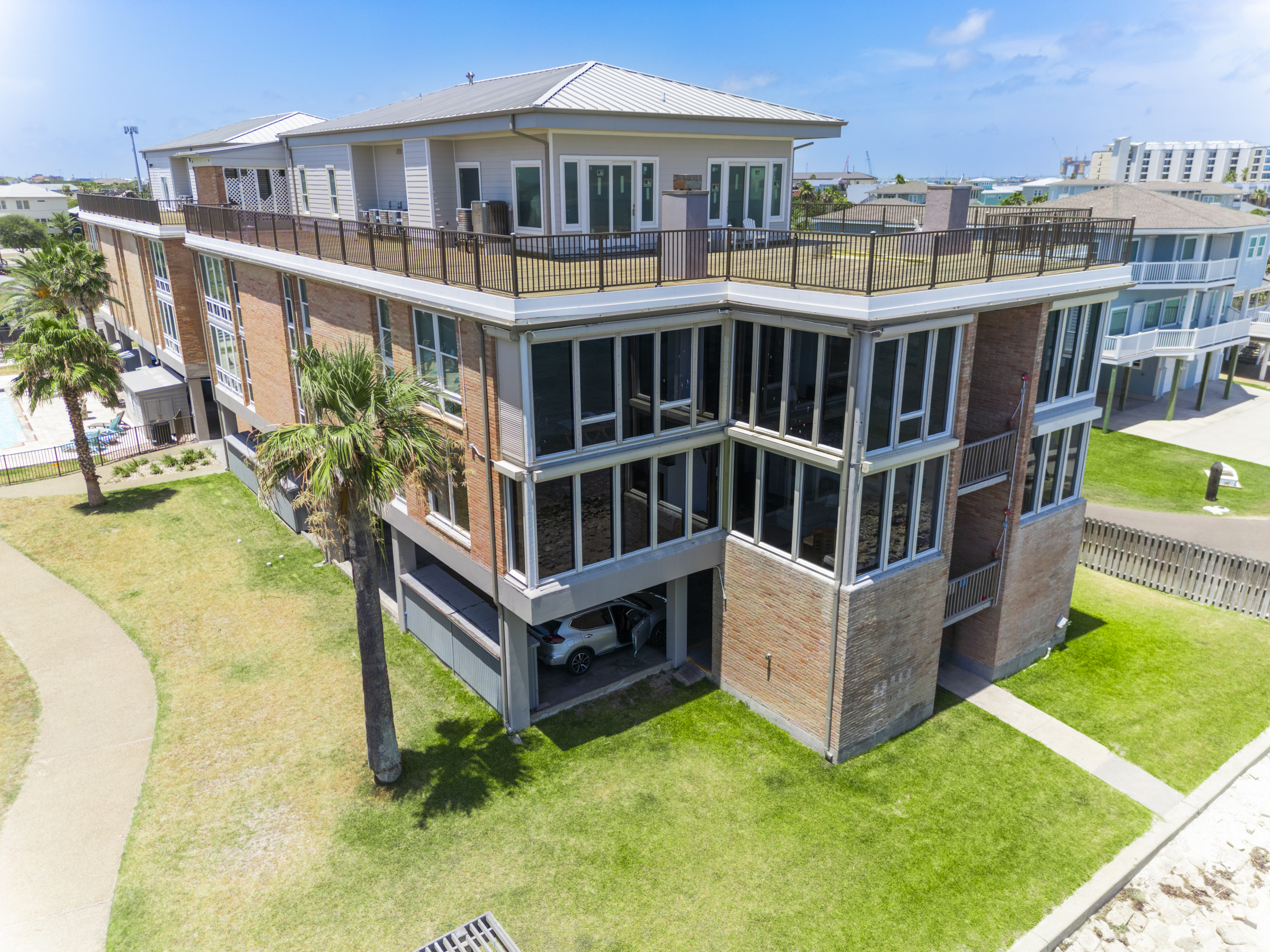 View of Channelview Penthouse Rooftop and Windowfronts of Units Facing Channel