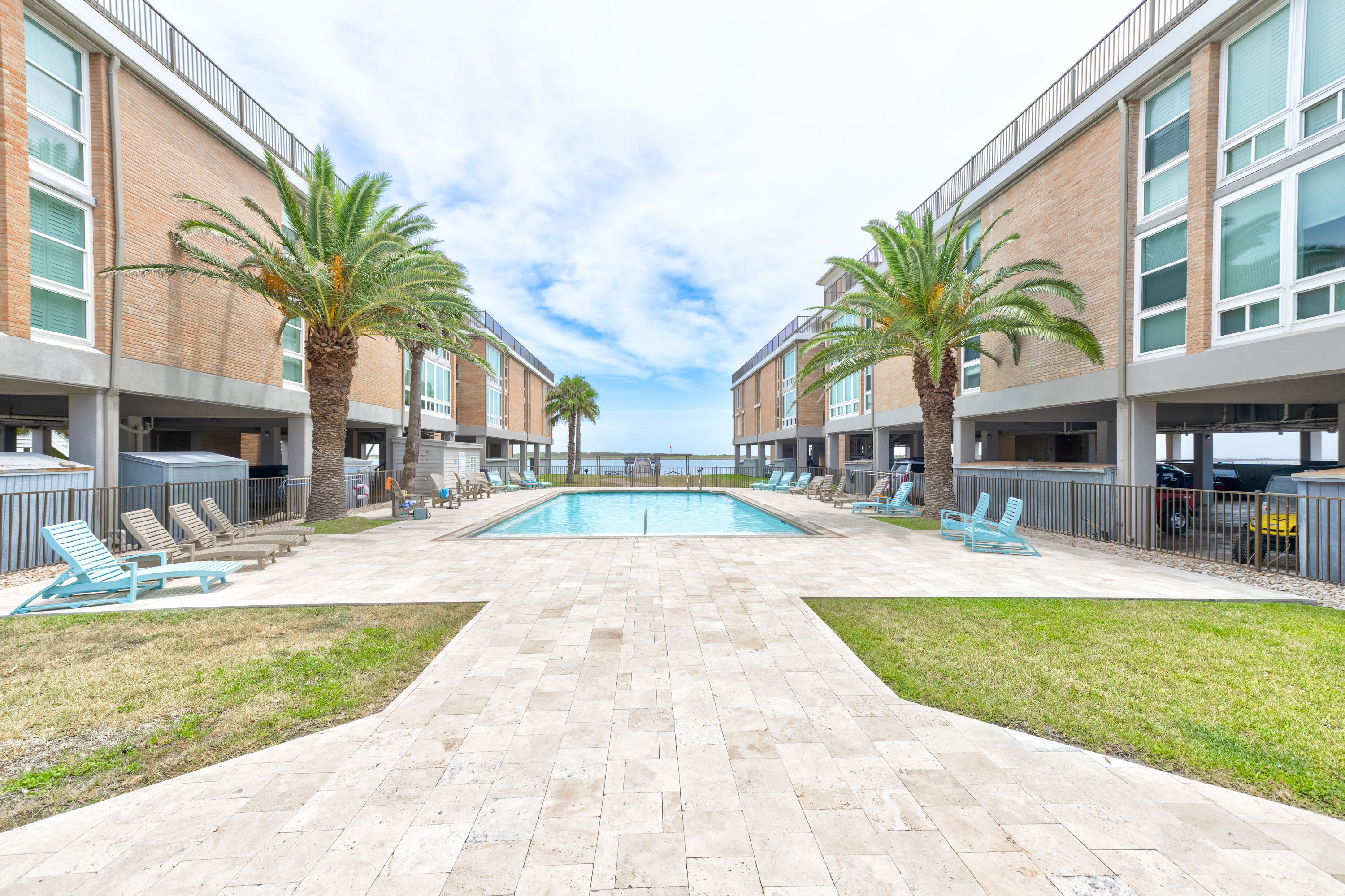 Community Pool with Lounge Seating and Scenic Views