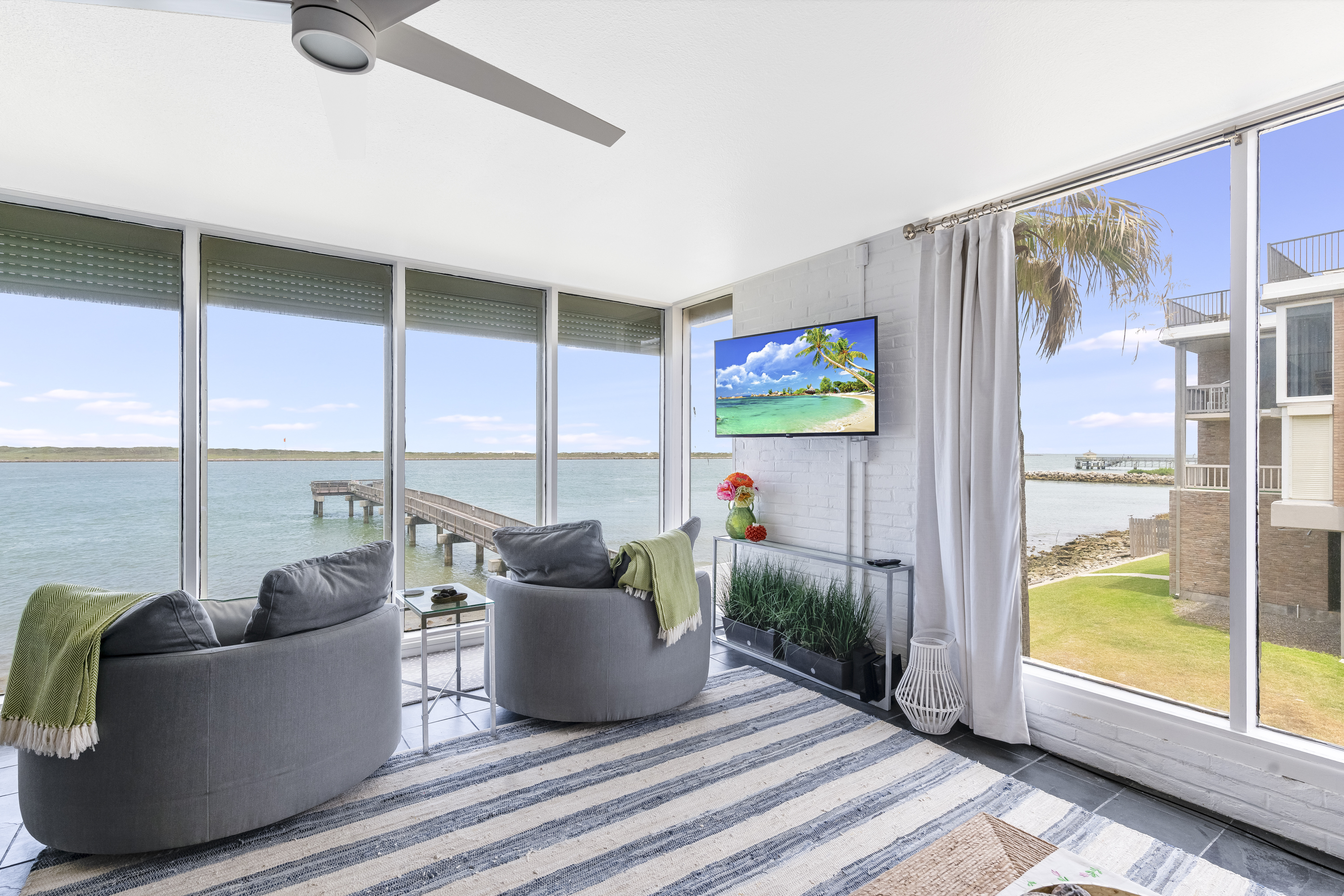 Waterfront Condo with Private Fishing Pier and Serene Channel Views