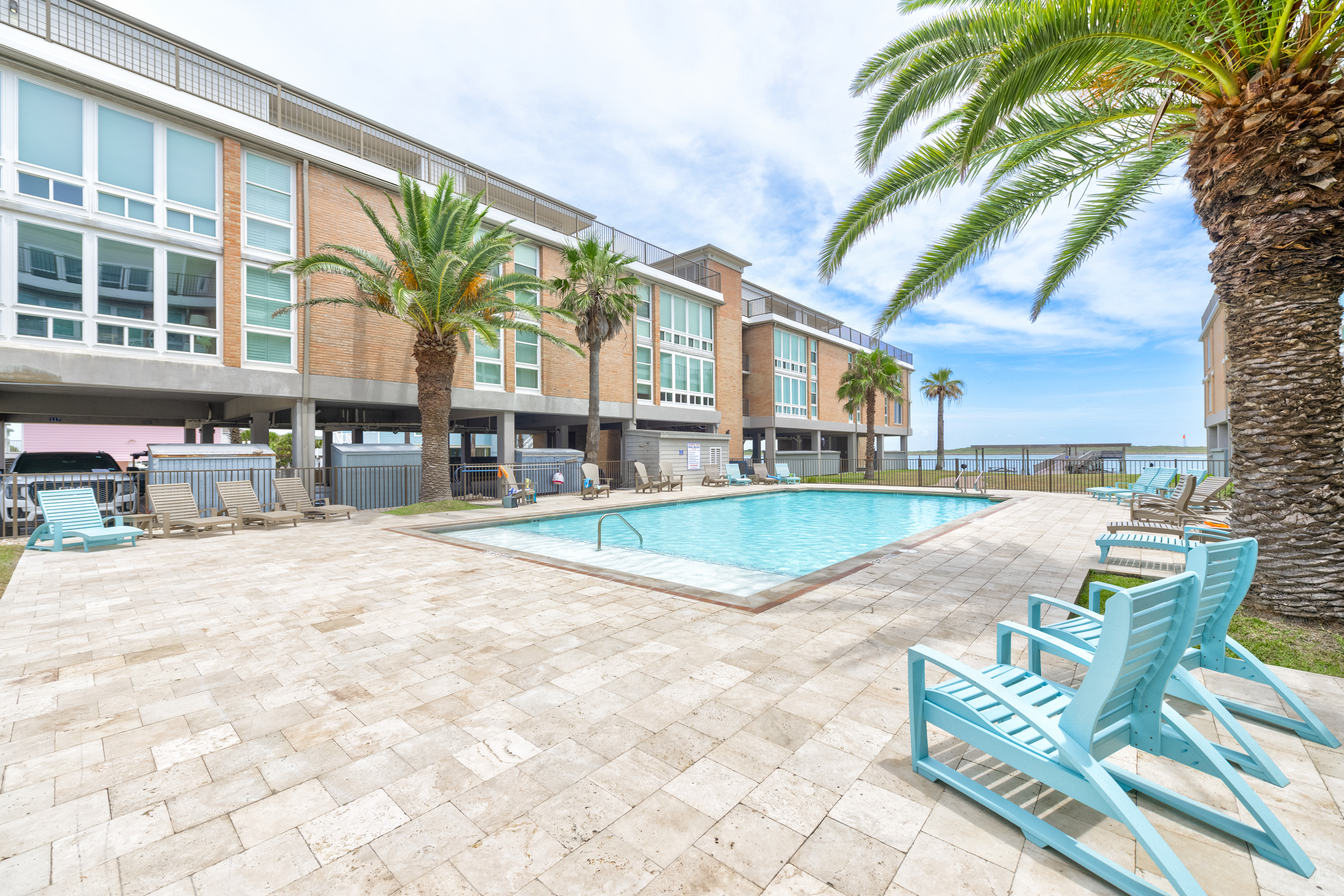 Relax by the Community Pool with Peaceful Water Views