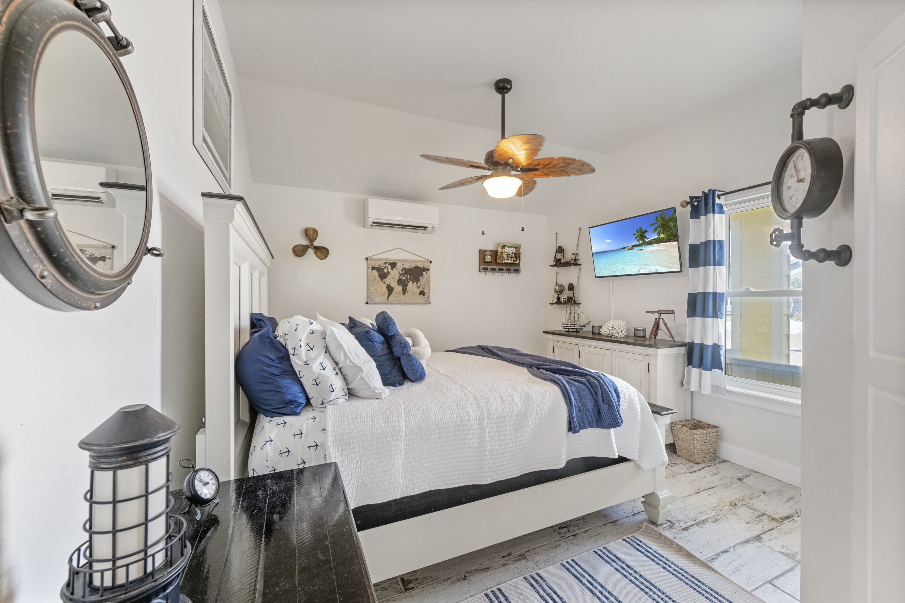 Spacious and Sunlit Queen Bedroom with Coastal Touches Throughout 