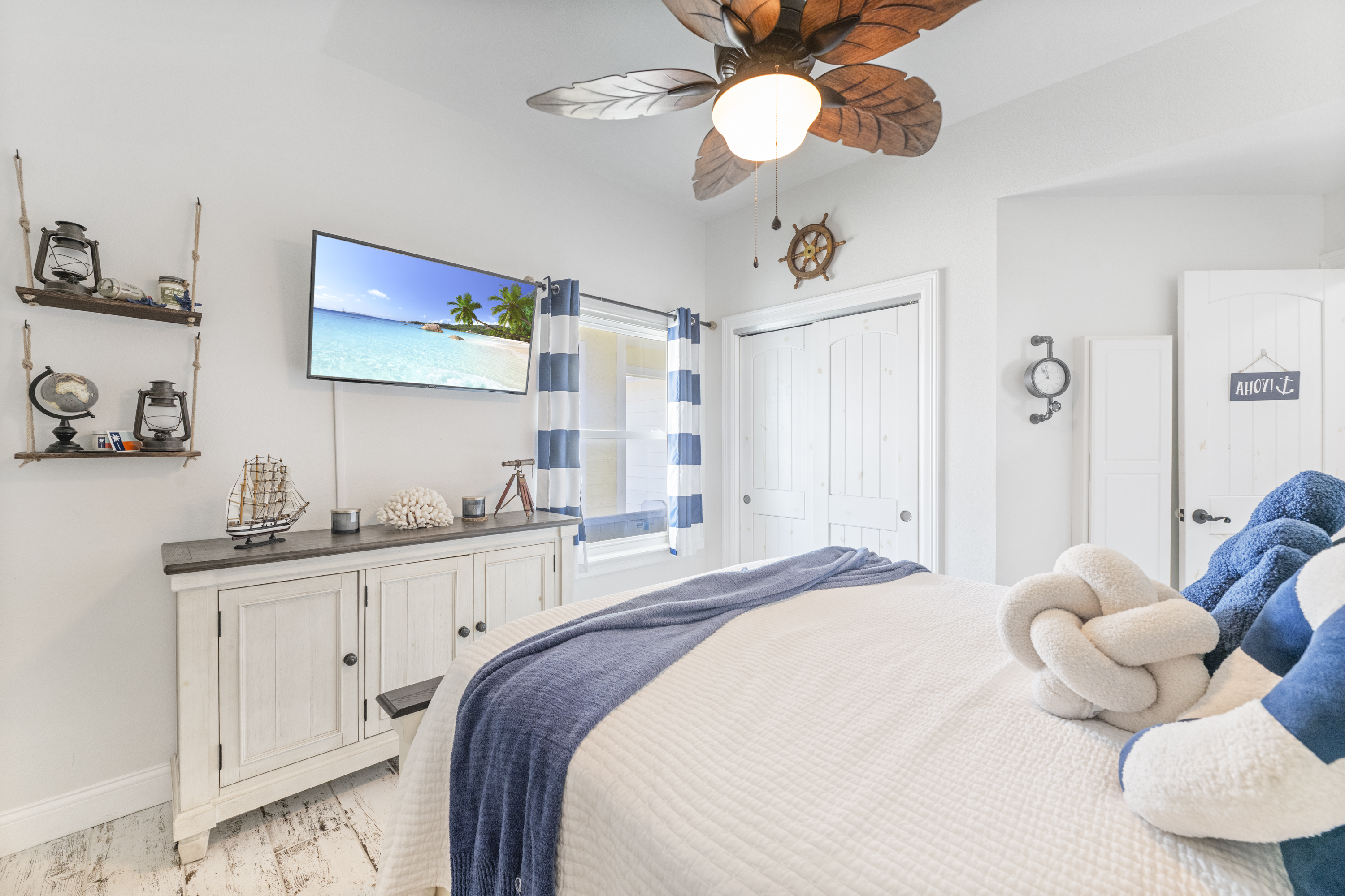 Queen Bedroom Equipped with TV to Relax in Laid-Back Coastal Charm